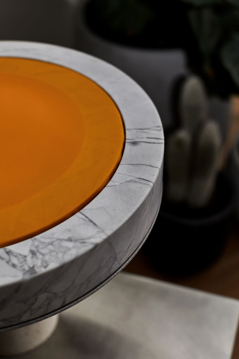 Close view of the marble ring and orange disc, unlit